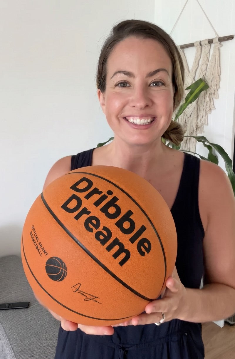 Mom holding a Dribble Dream basketball