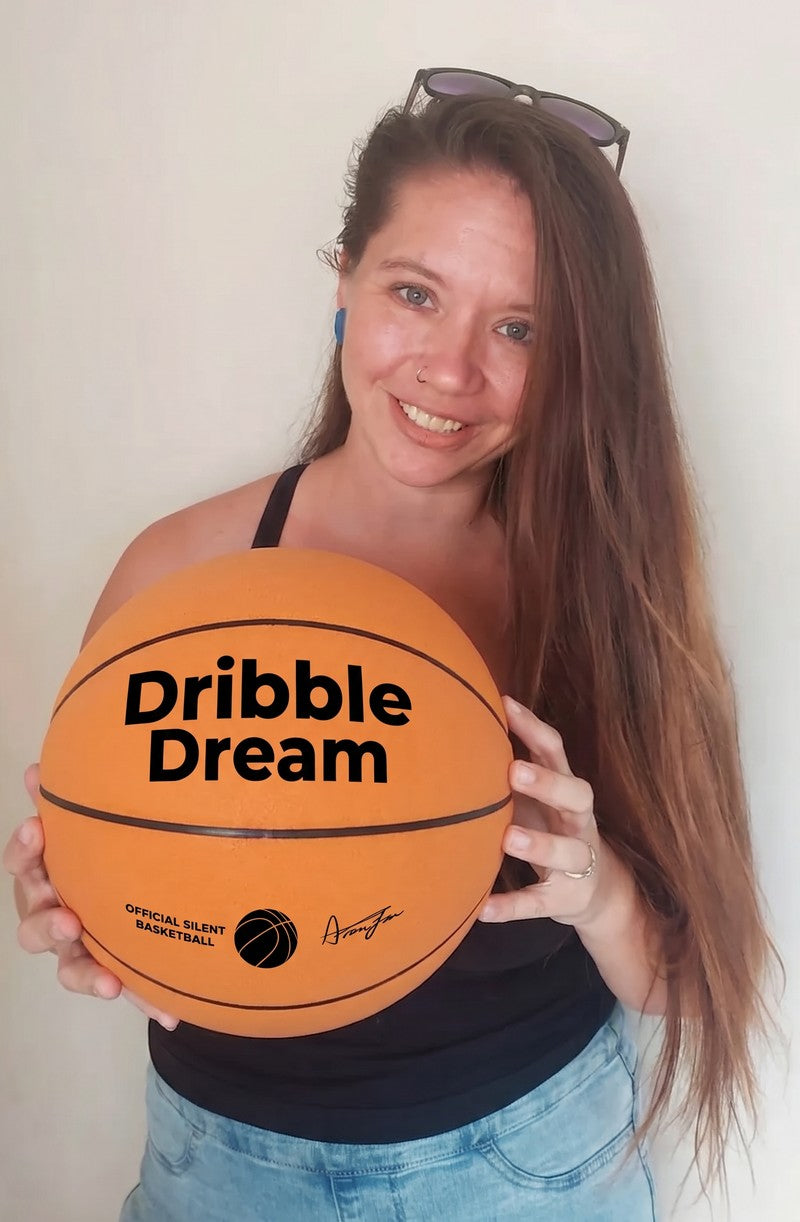 Mom holding a Dribble Dream basketball